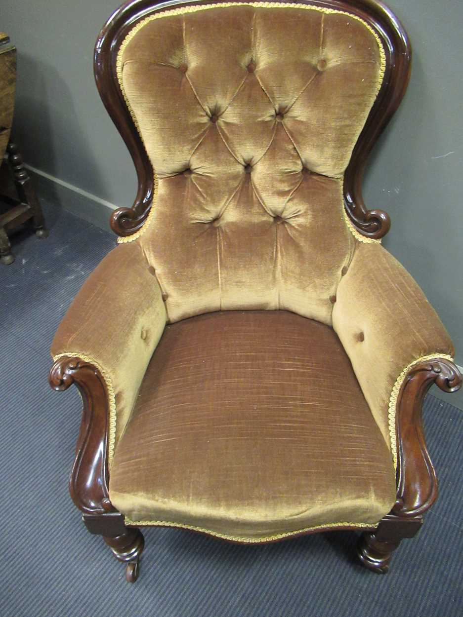 A mid-Victorian mahogany button back scroll carved armchair on turned legs and ceramic castors - Image 3 of 5