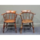 Two 19th century elm seat broad arm captain chairs