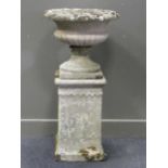 A garden urn on stand, 110cm high