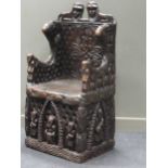 A Bamileke throne chair, profusely carved with animals, patterns and figures 140 x 70 x 55cm