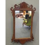 A Georgian style fret frame wall mirror 85 x 52cm