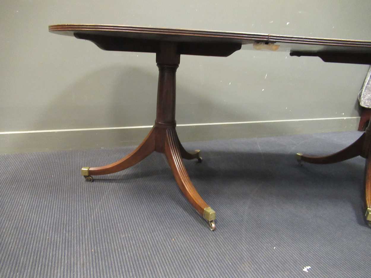 A George III style mahogany twin pedestal dining table with one leaf, early 20th century, the - Image 3 of 8