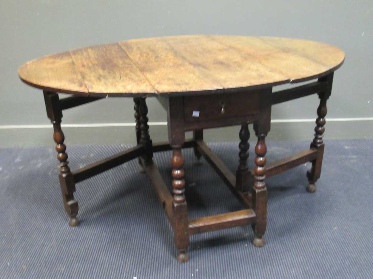 A 19th century oak gateleg table with single end drawer on turned legs 74 x 108 x 141cm open and - Image 3 of 4