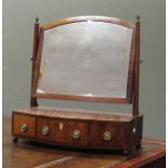A 19th Century mahogany toilet mirror with three drawer bow front base on ball feet 61.5cm wide.
