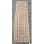 A hand-knotted Kelim runner 312 x 87cm
