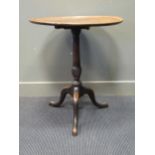 A George III occasional table, the dished top on a spirally fluted pillar and three cabriole legs,