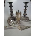 A collection of silver plated items including a pair of telescopic candlesticks, a cased carving