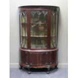 An Edwardian mahogany bow front cabinet on stand, 195 x 128.5 x 45 cm