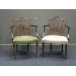 A pair of Hepplewhite style mahogany open armchairs with shield shaped backs, outscrolling arms