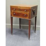A George III mahogany gentleman's washstand with twin hinged top on square tapered legs and brass