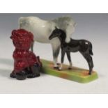 A Royal Doulton flambe fo-dog and a Beswick horse and foal (2)