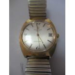 A Favre Luba Fellowship Twin Matic gentleman's gold-plated wristwatch on an aftermarket expanding