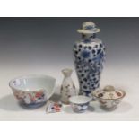 An 18th century Chinese tea bowl, a blue and white vase, Imari bowl A/FCondition report: Marking and