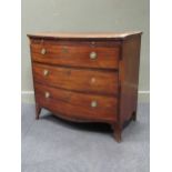 A Regency mahogany bow front chest with brushing slide above three long drawers on splayed bracket