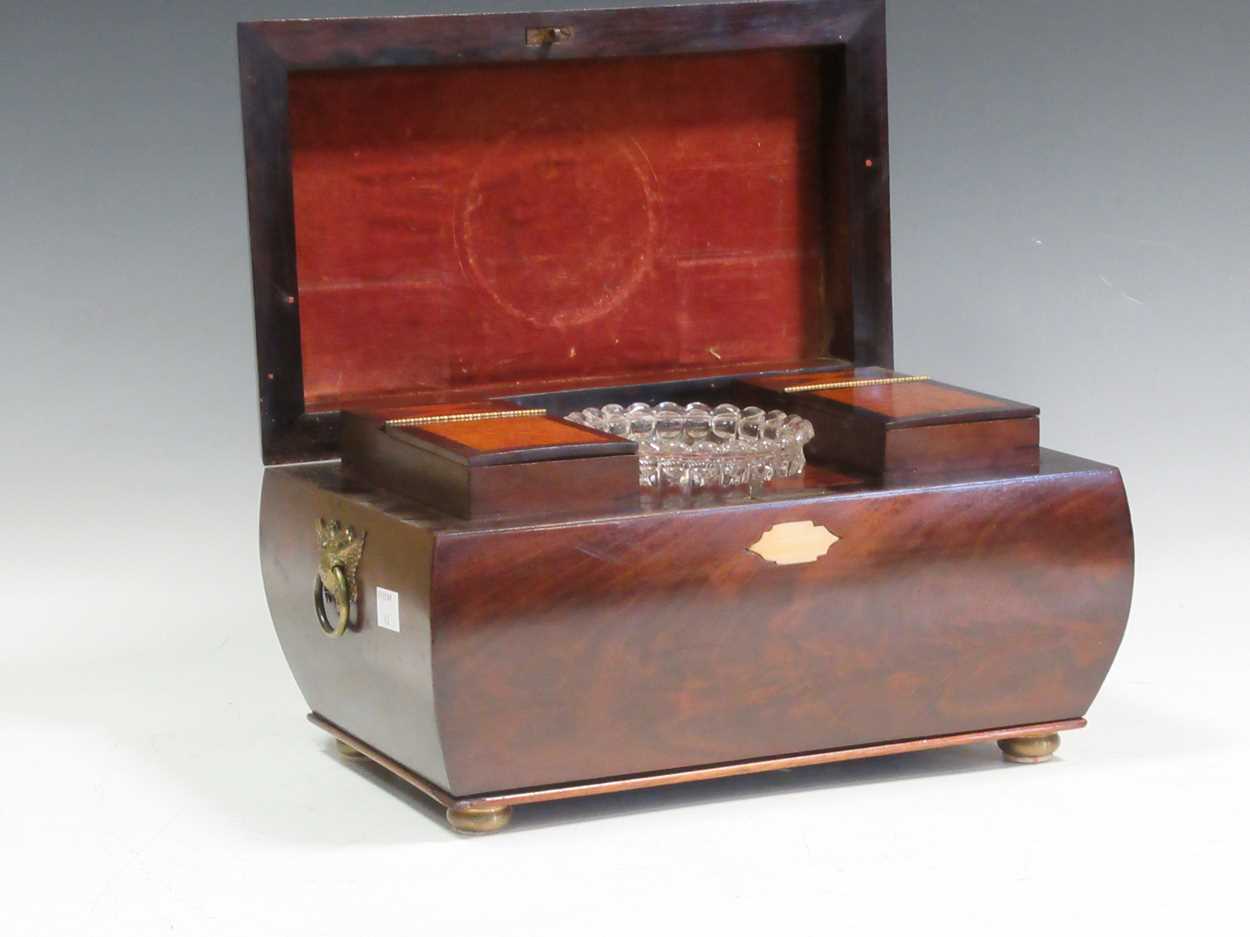 A good 19th century bombé tea caddy with specimen wood inlaid top