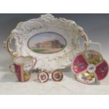 A 19th century German porcelain comport deocrated with a stately home, together with a French
