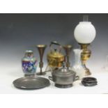 A brass oil lamp with white glass shade, together with a brass kettle on stand with burner; A