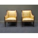 A pair of Edwardian mahogany and cross-banded padded armchairs, on spade feet (2)Condition report: