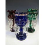 Three glass lustres, in green, blue and ruby, the tallest - 37cm high