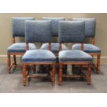 A set of five late Victorian turned oak and blue fabric upholstered dining chairs