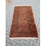 A hand-woven Afghan rug