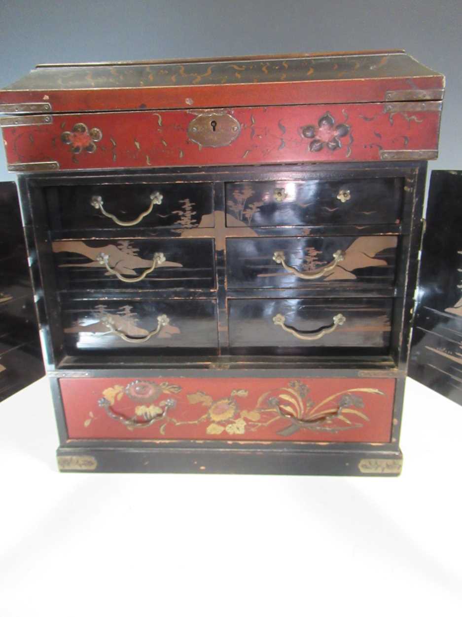 A Japanese meiji period lacquered table cabinet, the two doors enlcosing drawers, with side - Image 4 of 6