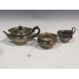 An Edwardian silver three-piece bachelor's tea set, 22.5ozt gross (3)
