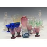 A collection of glasssware to include moulded candelsticks, amethyst wine glasses, thistle shaped
