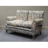 An Edwardian two-seat sofa, 150 cm wideAll legs have castors, the back right leg has been broken and