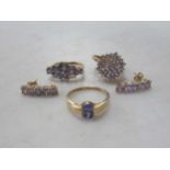 A 9ct tanzanite cluster ring and a pair of 9ct tanzanite earstuds both with accompanying guarantee