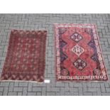 A Bokhara rug 141 x 97cm together with a Persian style rug 167 x 122cm (2)Provenance:Landwade