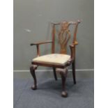 A George II style mahogany armchair with cabriole front legs on claw and ball feet