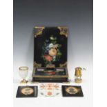 A Victorian papier-mache desk set, two silhouettes, a miniature miners lamp and a gilt metal mounted