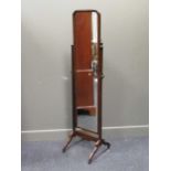 A 20th century walnut cheval mirror with fluted upright supports 170cm high and 43cm