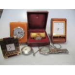 A Cartier clock together with a Jaeger Lecoultre clock, an Acqua Di Parma clock, a Fean Roulet