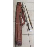 A collection of various fishing equipment to include an Ambidex reel, other reels. a fishing rod and
