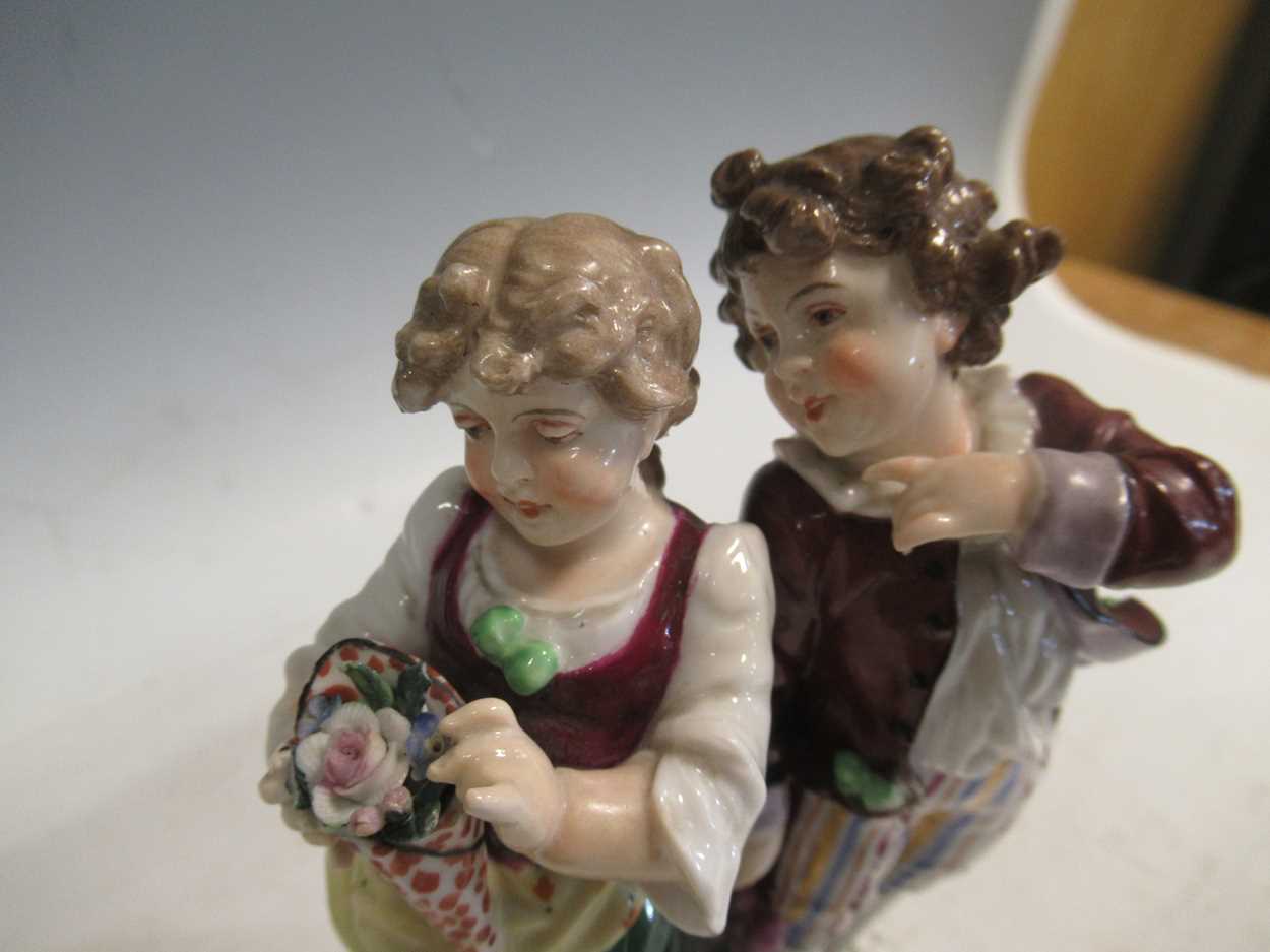 A pair of continental porcelain figurines in Meissen style and a continental porcelain vase and - Image 11 of 11