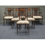An Edwardian parlour suite of six inlaid frame mahogany dining chairs including two armchairs, and a