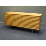 A contemporary pale oak veneered sideboard, 73 x 153 x 48 cm