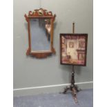 A 19th century rosewood pole screen, 138 cm high, together with a fret framed mirror