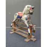 An early 20th century dapple grey rocking horse 120cm high