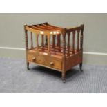 A 19th century mahogany canterbury, with four dividers, above a long drawers, ebony stringing, 53