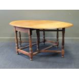 An large Victorian oak drop leaf dining table 77 x 121 x 180cm 77 x 121 x 64cm