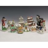 A collection of Staffordshire pottery to include pastille burners and figures