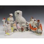 A collection of English ceramics to include staffordshire flat backs, spaniel etc