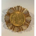 A sovereign dated 1958, in a pendant/brooch mount tested as 18ct gold, gross weight 17.3g