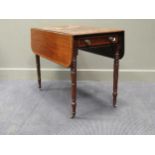 A Regency mahogany and satinwood cross banded Pembroke table, on ring turned legs with castors (