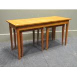 A 20th century blonde oak nest of tables, largest 46 x 92 x 38cm (3)