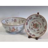 A Sampson famille rose armorial punch bowl, decorated in 18th century Chinese style, 29cm
