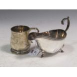 A silver sauce boat together with a small silver mug, 10.3ozt gross (2)